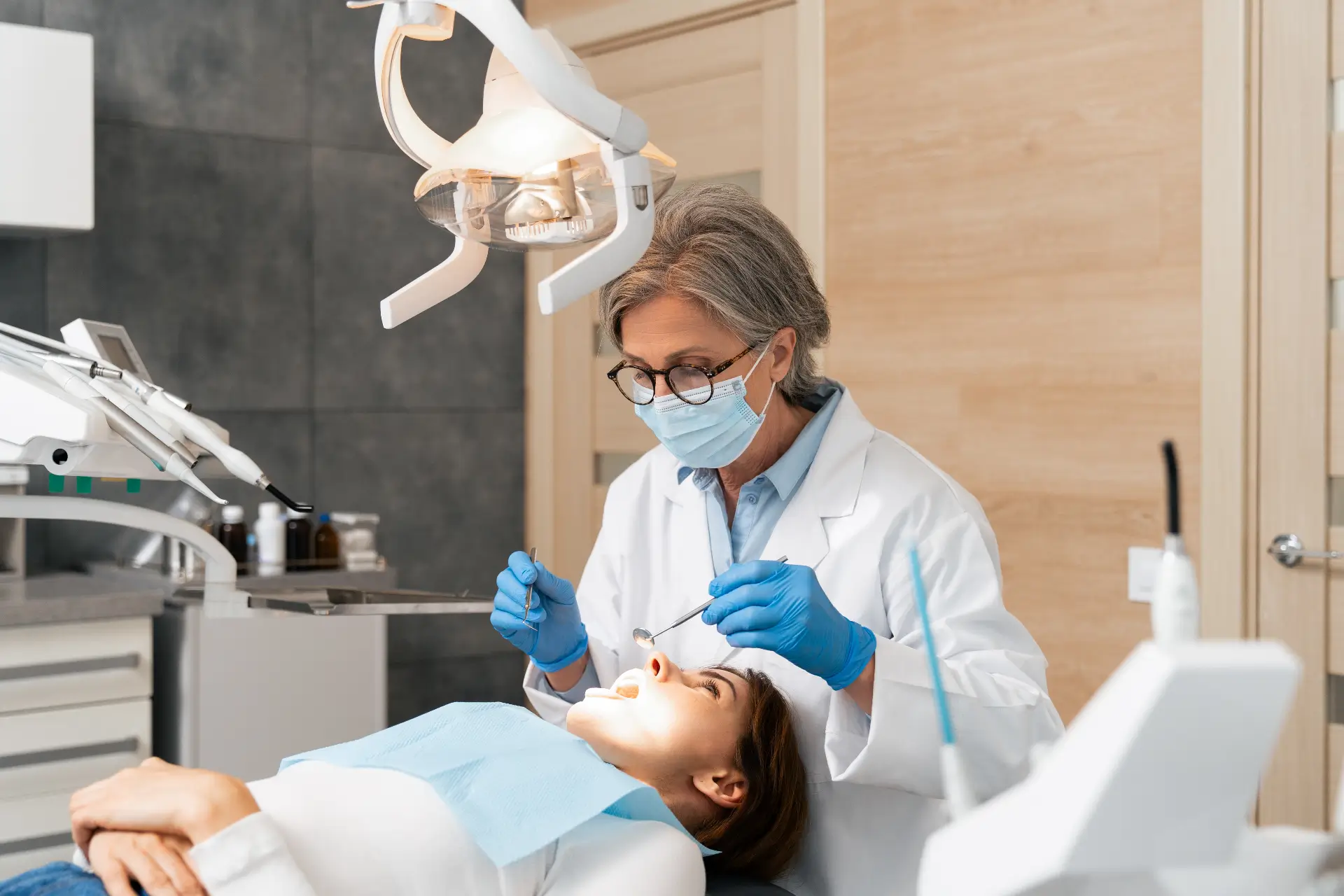 Patient Sitting In Dental Chair During Examination