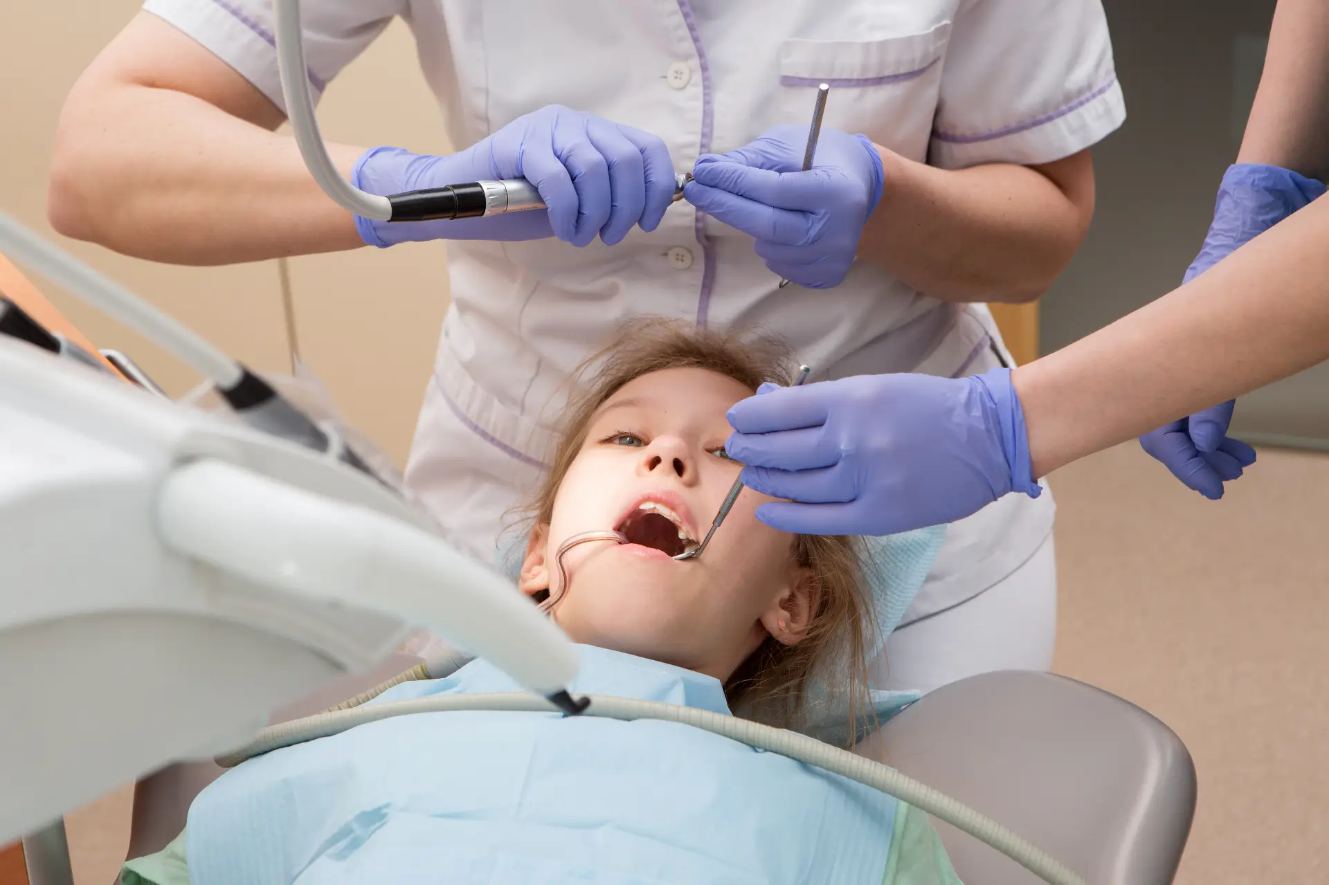 Patient Sitting In Dental Chair During Examination