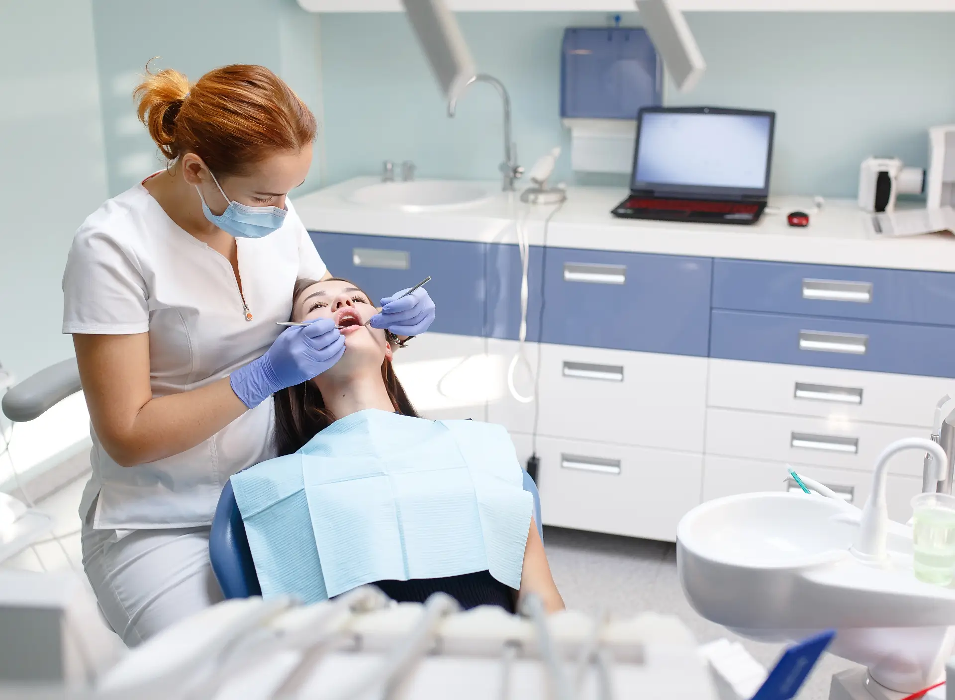Patient Receiving Dental Check-Up From Dentist