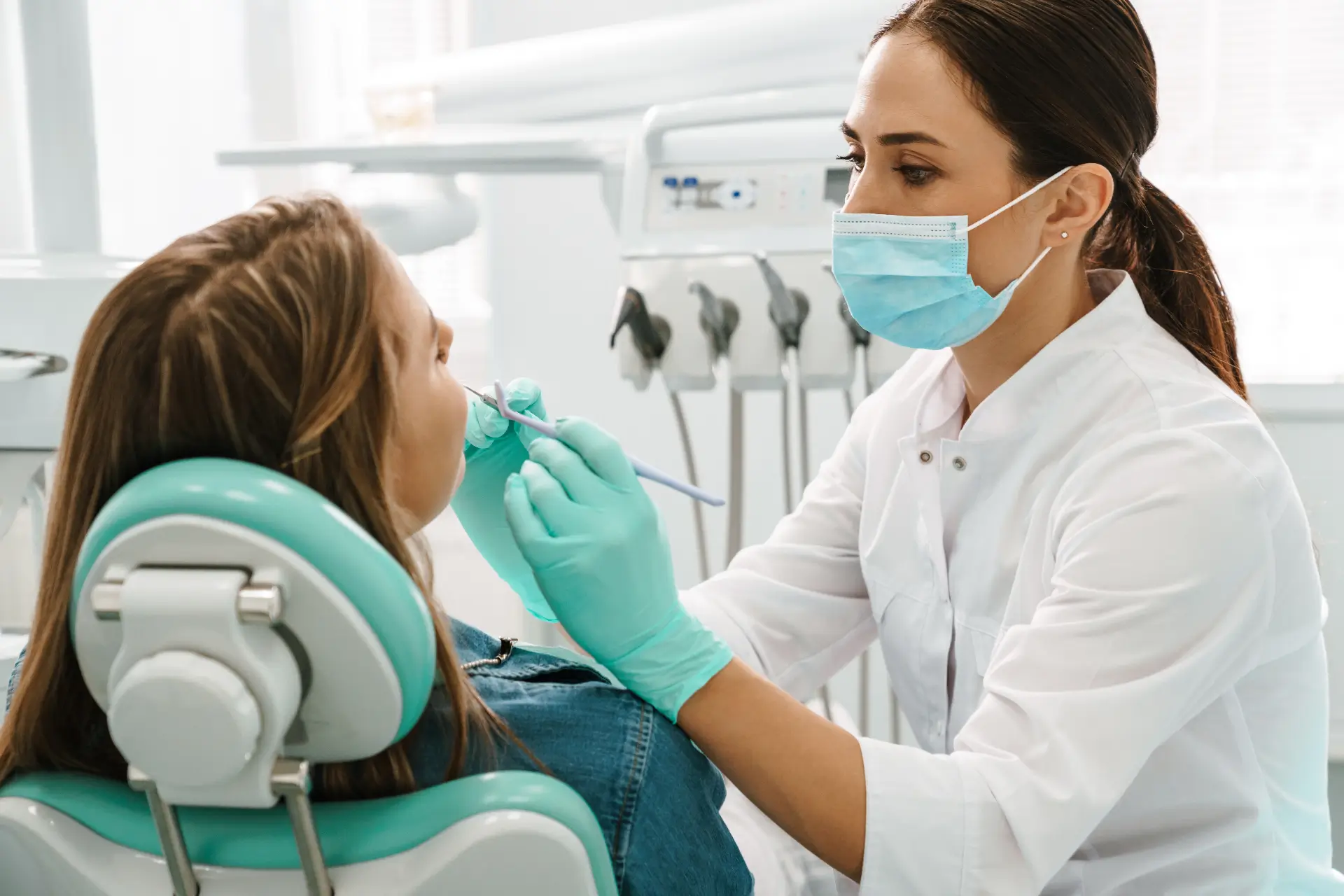 Patient Receiving Dental Check-Up From Dentist