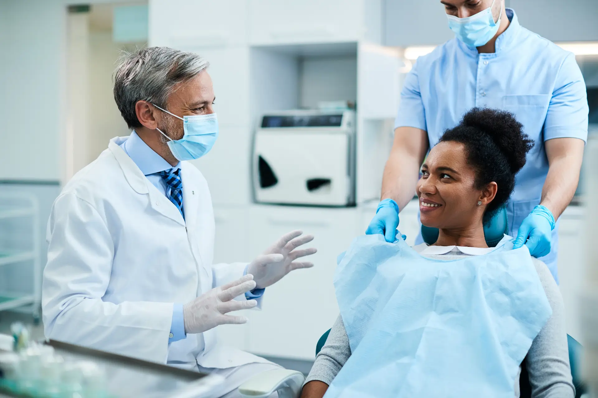 Nervous Patient Being Reassured At Dental Clinic