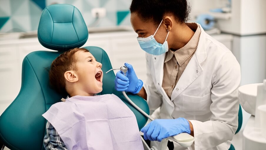 Patient receiving dental check-up from dentist