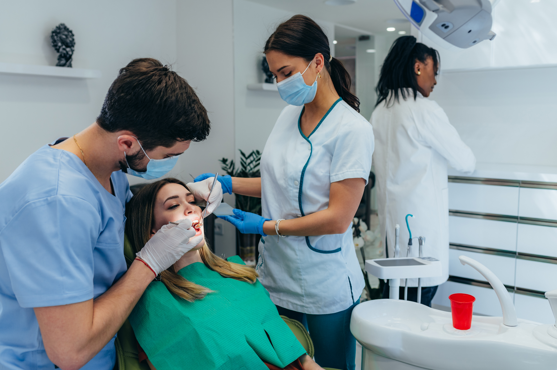Patient Sitting In Dental Chair During Examination