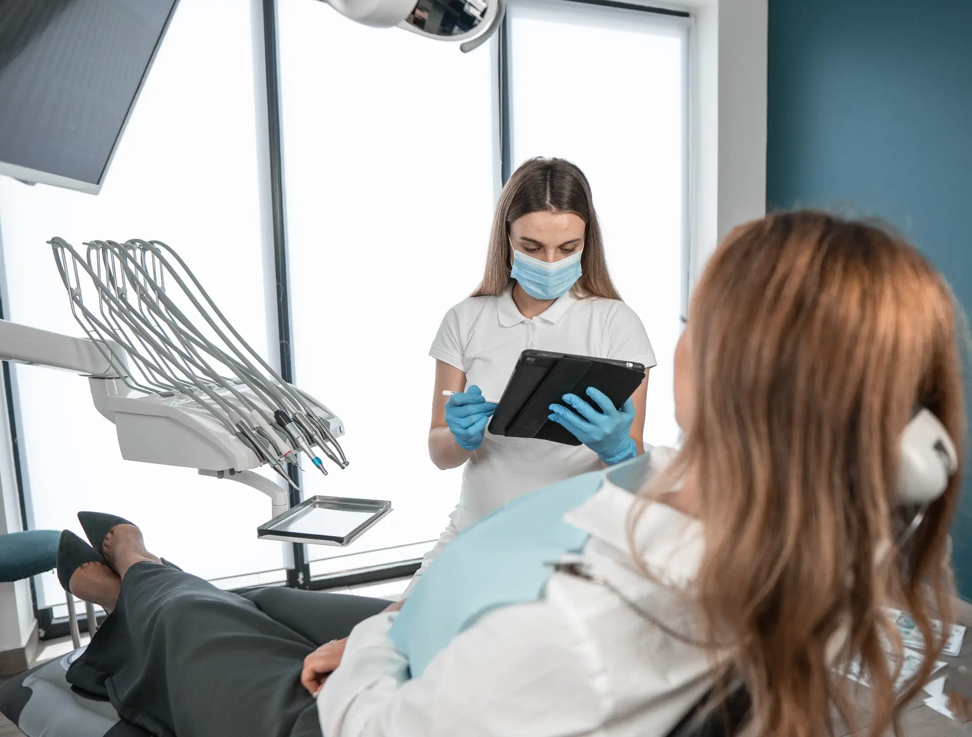 Patient Receiving Dental Check-Up From Dentist