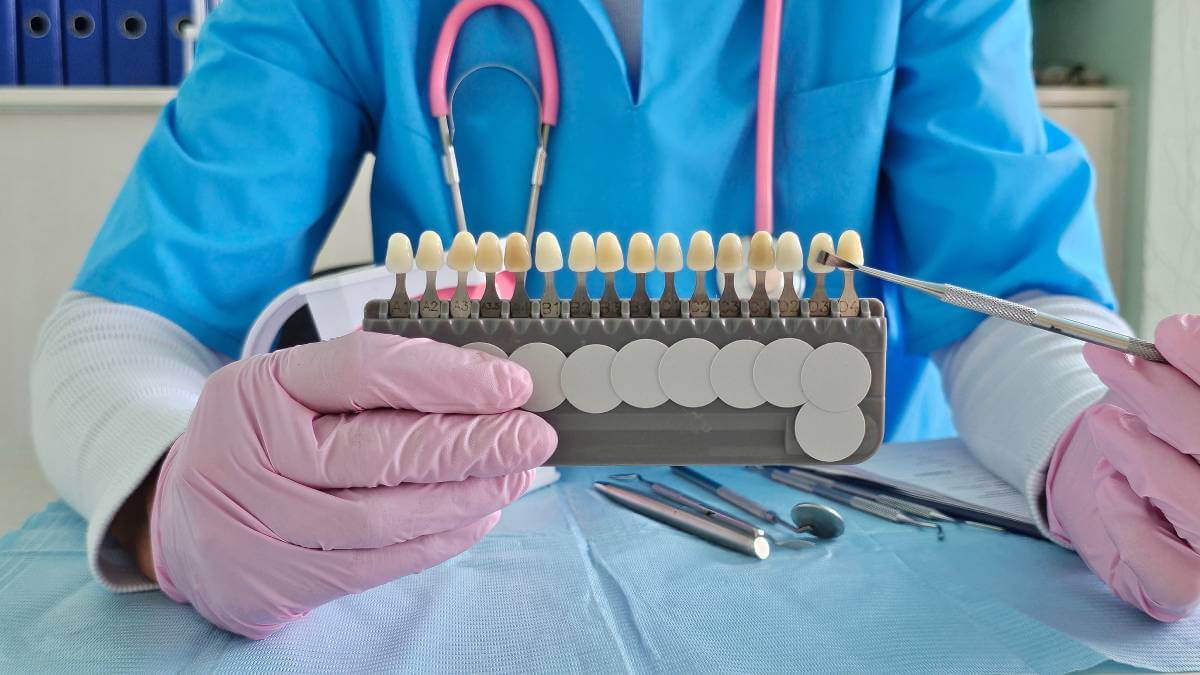 dentist pointing at veneers